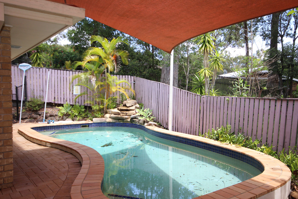 SECLUDED 3 BEDROOM HOME WITH INGROUND POOL.