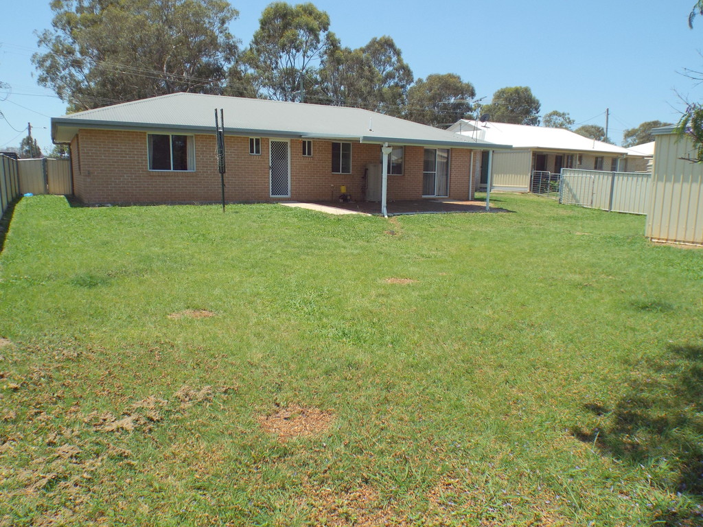 4 Bedroom brick home, 2 bay colorbond shed, double carport,  close to school.