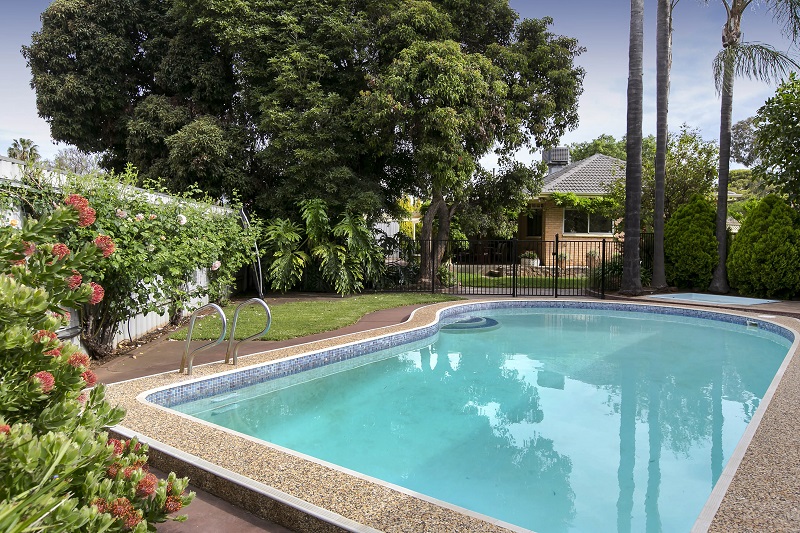 Under Contract- Summer nights by the pool with a blue chip location..