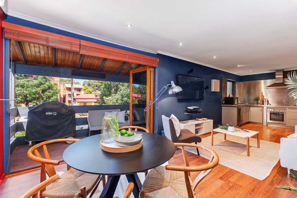 This stylish urban pad boasts a sleek and modern update with heated outdoor entertaining.