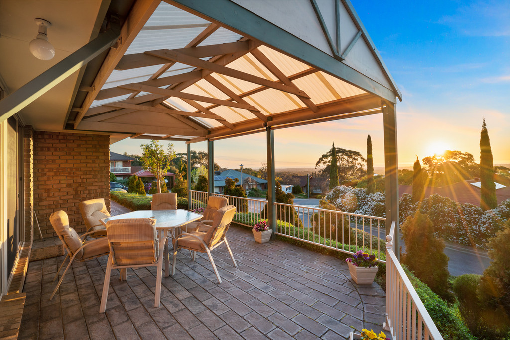 Beautiful sunset happy hour with views to the ocean in Prestigious Woodland Ridge Estate