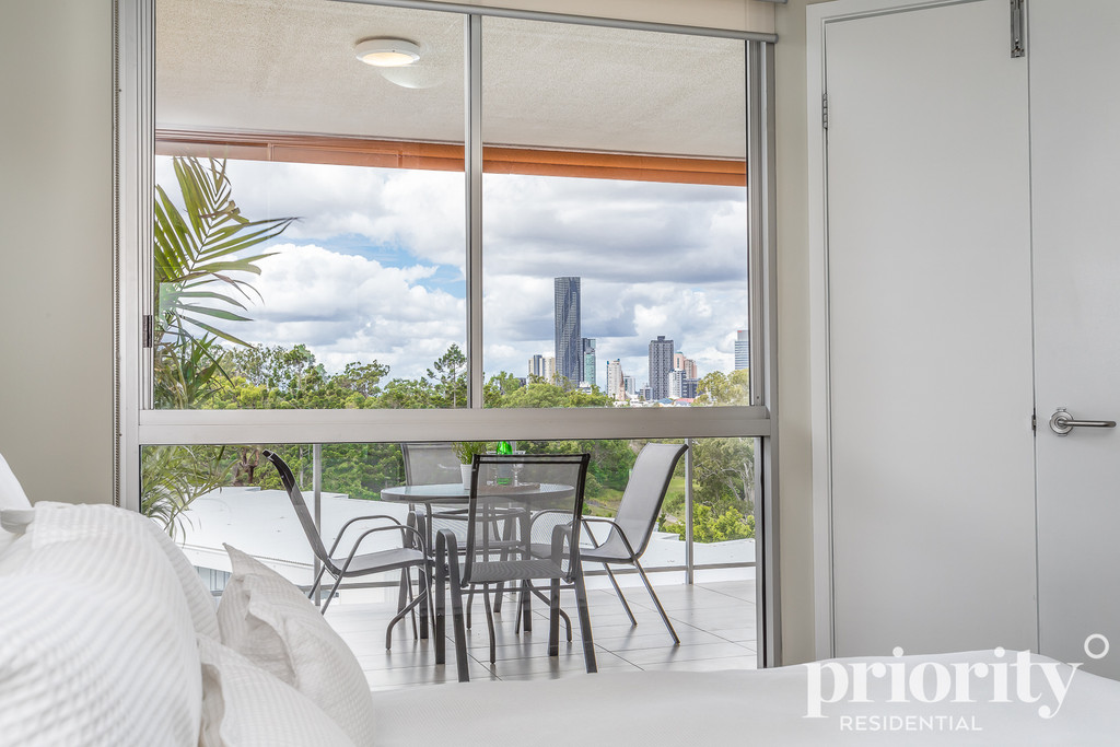 Price Reduced! Pristine Top Floor Living + City Views